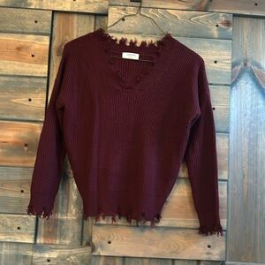 Districted burgundy sweater in perfect condition!